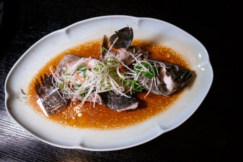 Steamed Grouper on the Chinese New Year Menu at Hakkasan Shanghai. Photo by Rachel Gouk.