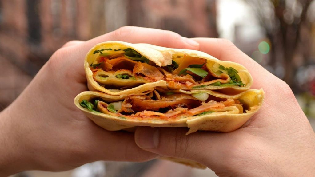 Jianbing is China's most popular breakfast street food. Photo via UnTour Food Tours.