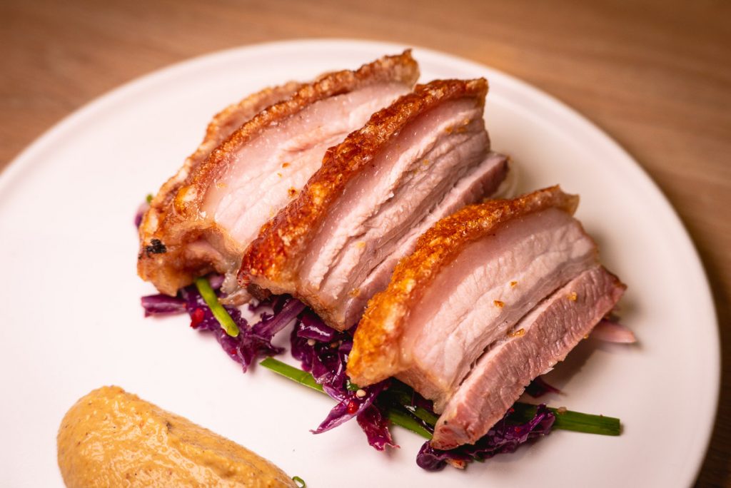 Crispy Pork Belly at Heritage by Madison, a restaurant in Shanghai by chef Austin Hu serving a seamless mix of Western and Asian influences. Photo by Rachel Gouk.