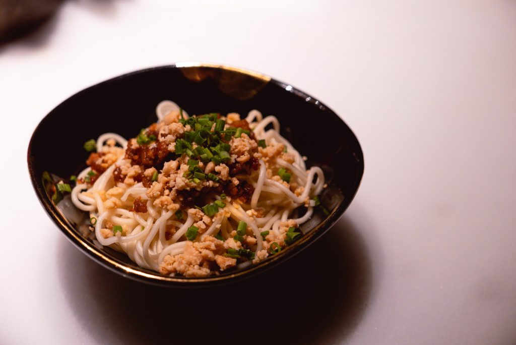 Dan Dan Mian noodles with minced pork, chili oil, crushed peanuts and scallions. Sichuan cuisine at The Peacock Room, a contemporary Chinese restaurant in Shanghai. Photo by Rachel Gouk