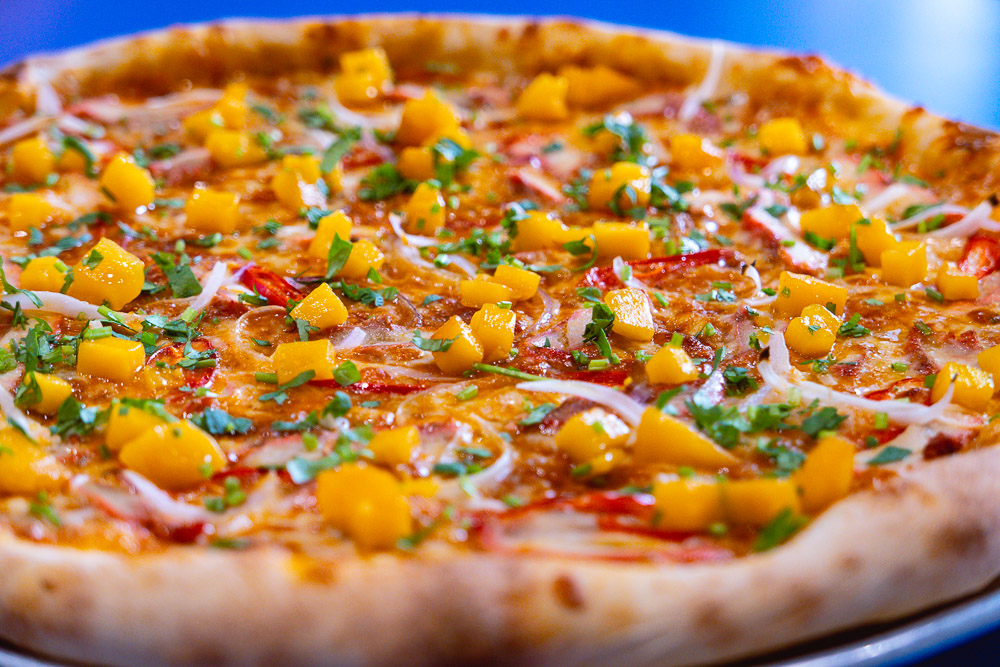 Chicken tikka pizza at Homeslice. Best pizzas in Shanghai - Homeslice for New York-style pizzas. Photo by Rachel Gouk @ Nomfluence.