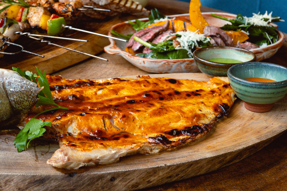 Charcoal grilled sea bass at Barbarian North Bund, a restaurant and bar in Shanghai. Photo by Rachel Gouk @ Nomfluence.