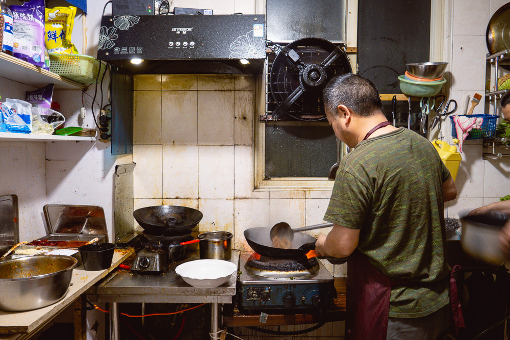In the kitchen. La Wei Xian 辣味鲜 is a private kitchen serving authentic Sichuan food in Shanghai. Photo by Rachel Gouk @ Nomfluence.