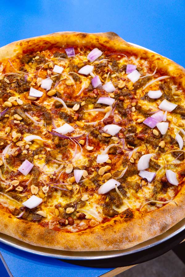 Rachel Gouk aka Nomfluence does a Malaysian inspired pork satay pizza at Homeslice Shanghai. Photo by Rachel Gouk @ Nomfluence.